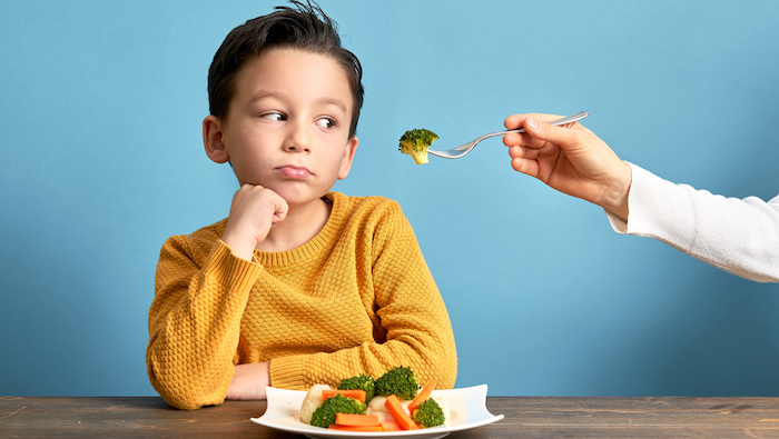 child is very unhappy with having to eat vegetables.